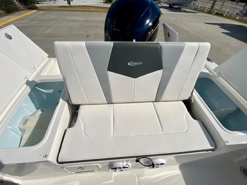 Slide: The Image of 2024 Robalo 226 Cayman boat with white and gray seating. - 9