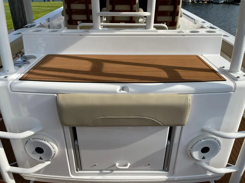 Slide: The Image of 2019 Everglades 435 CC boat deck with seating and storage compartments. - 14