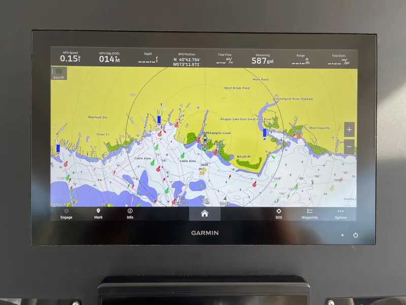 Slide: The Image of Garmin navigation display on 2019 Everglades 435 CC boat, showing coastal map and data. - 31