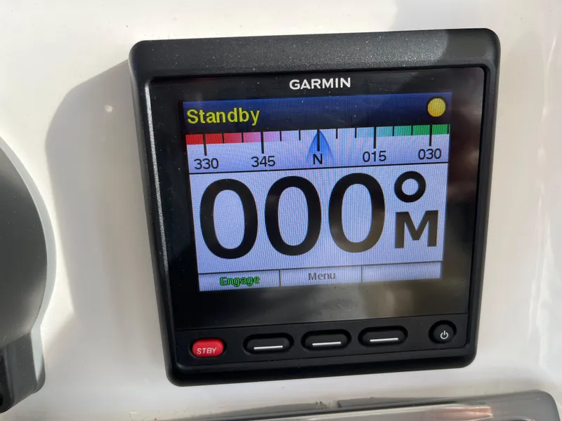 Slide: The Image of Garmin marine display on 2019 Everglades 435 CC, showing compass heading in standby mode. - 34