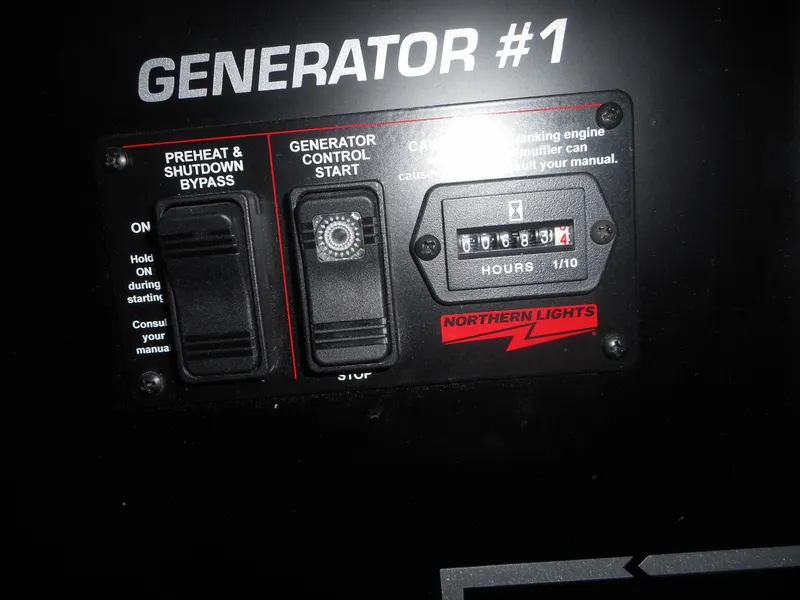 Slide: The Image of Adonia Radiance Share #12 generator control panel with hour meter and start switch, 2022 model. - 10