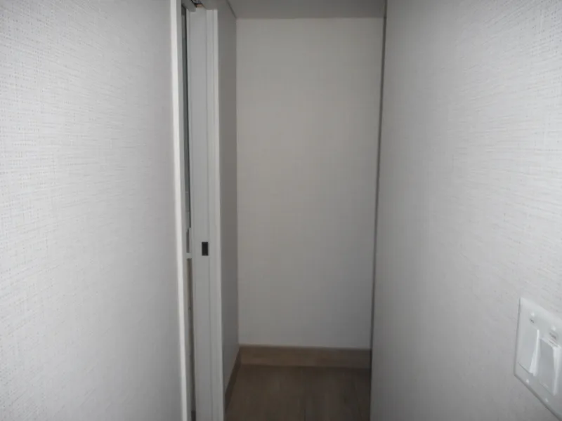 Slide: The Image of Narrow hallway with white walls and a sliding door, Adonia Radiance Share #12, 2022. - 19