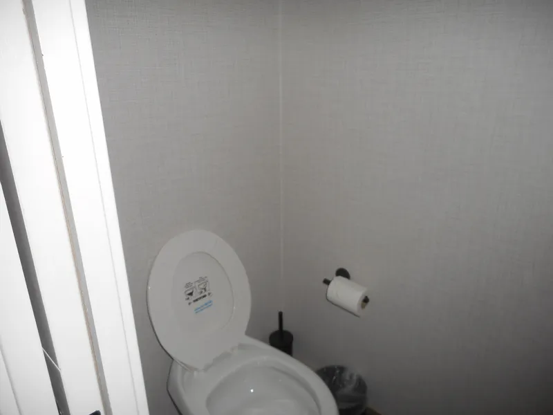 Slide: The Image of Small bathroom with toilet, toilet paper, and brush; Adonia Radiance Share #12, 2022 model. - 21