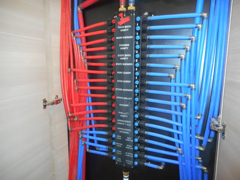 Slide: The Image of Water distribution manifold with labeled red and blue pipes, Adonia Radiance Share #12, 2022 model. - 22