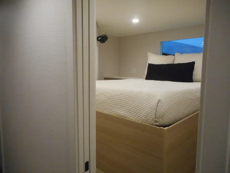 Slide: The Image of Cozy bedroom in Adonia Radiance Share #12, 2022 model, featuring a neatly made bed. - 25