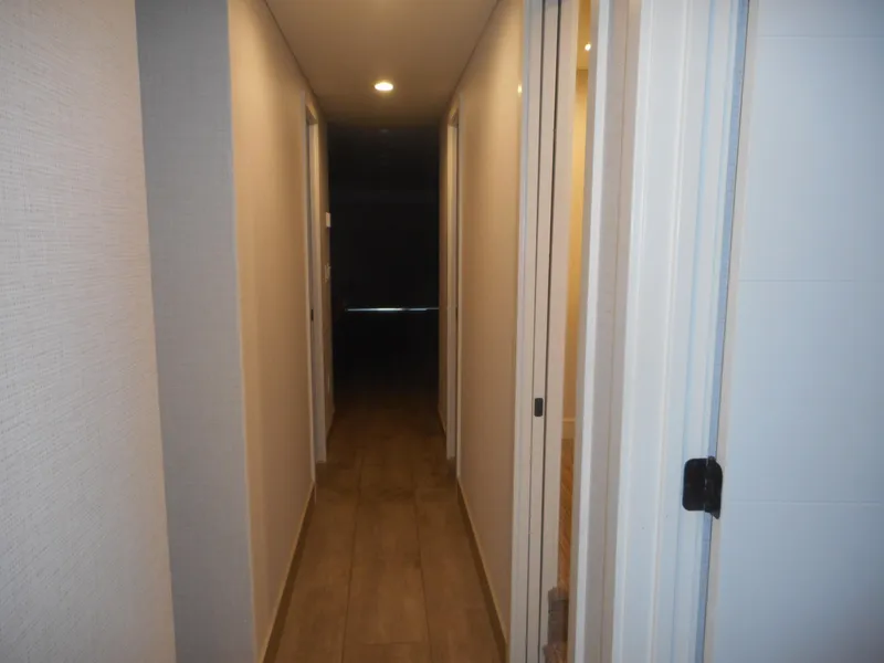 Slide: The Image of Narrow hallway with wooden flooring and white walls, Adonia Radiance Share #12, 2022. - 26