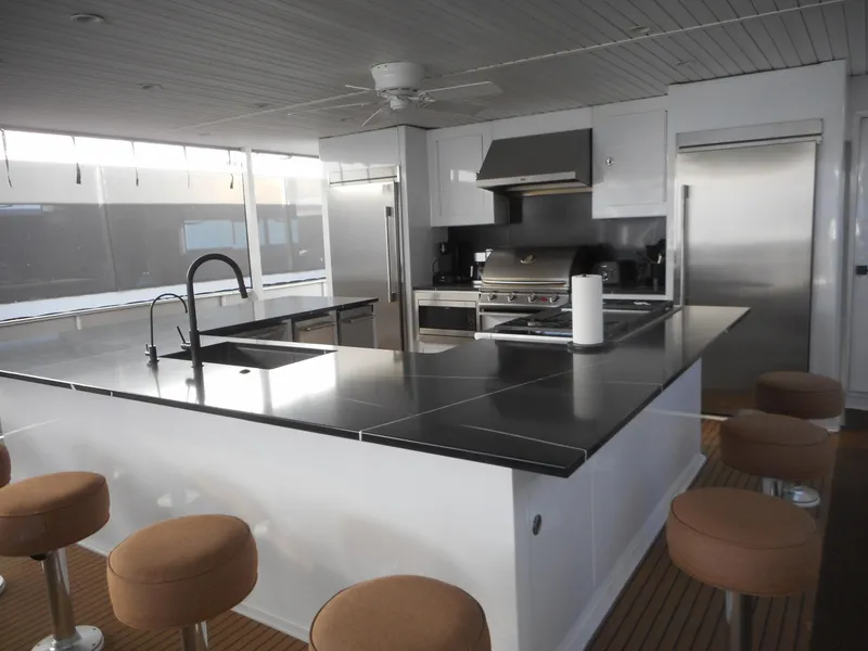 Slide: The Image of Modern kitchen on Adonia Radiance Share #12, 2022, featuring sleek countertops and stainless steel appliances. - 49