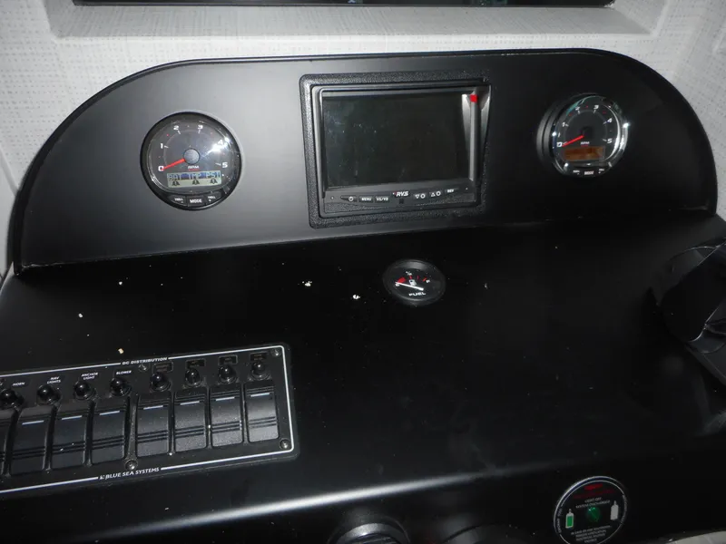 Slide: The Image of Control panel of Adonia Radiance Share #12, 2022 model, featuring gauges and switches. - 8