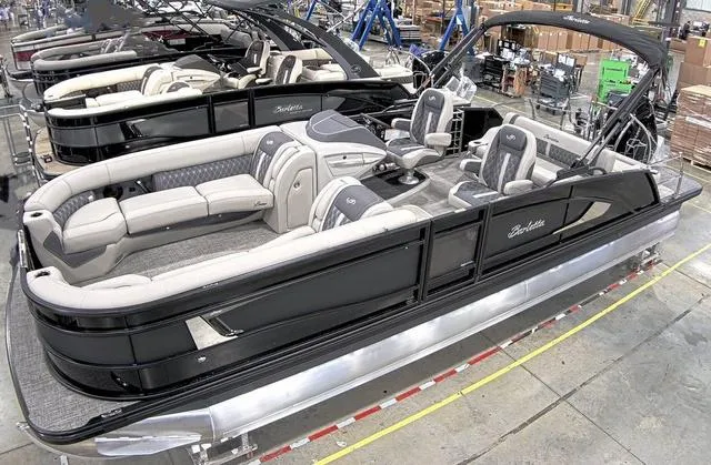 Slide: The Image of 2024 Barletta Boats Lusso 25UC pontoon boat with luxurious seating and sleek black design. - 1
