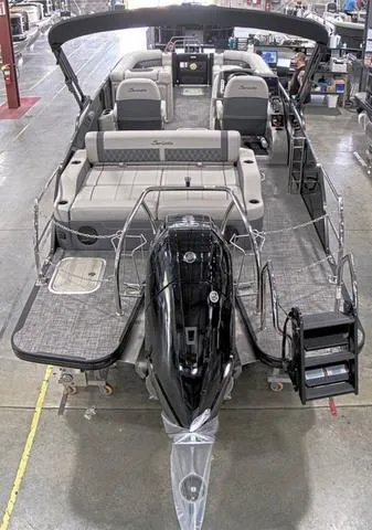 Slide: The Image of 2024 Barletta Boats Lusso 25UC pontoon boat in a showroom. - 3