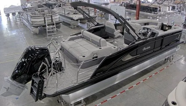 Slide: The Image of 2024 Barletta Boats Lusso 25UC pontoon boat in a showroom. - 4