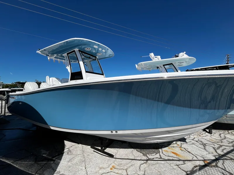 Slide: The Image of 2024 Sportsman Open 252 Center Console boat in blue on display. - 0