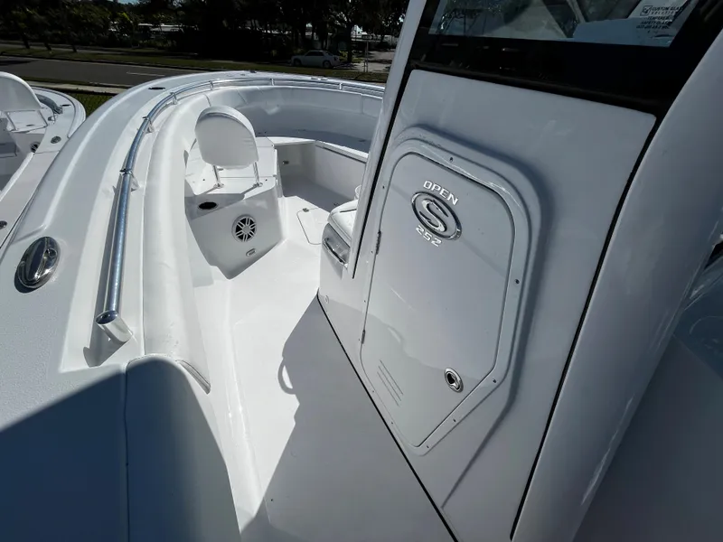 Slide: The Image of 2024 Sportsman Open 252 Center Console boat interior, featuring seating and storage compartments. - 15