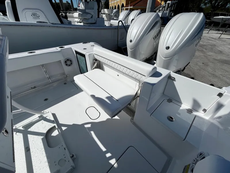 Slide: The Image of 2024 Sportsman Open 252 Center Console boat with dual Yamaha engines. - 5