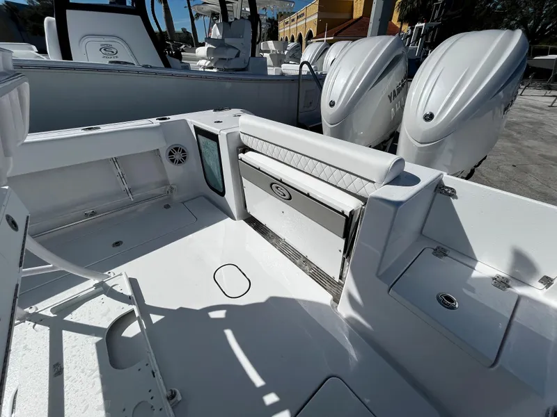 Slide: The Image of 2024 Sportsman Open 252 Center Console boat interior with dual outboard engines. - 6