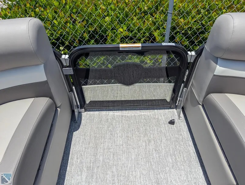 Slide: The Image of 2024 Premier 230 Sunsation RE boat interior with gray seating and safety gate. - 10