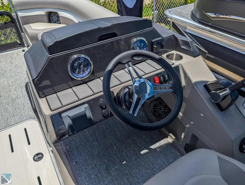 Slide: The Image of 2024 Premier 230 Sunsation RE boat dashboard with steering wheel and instrument panel. - 5