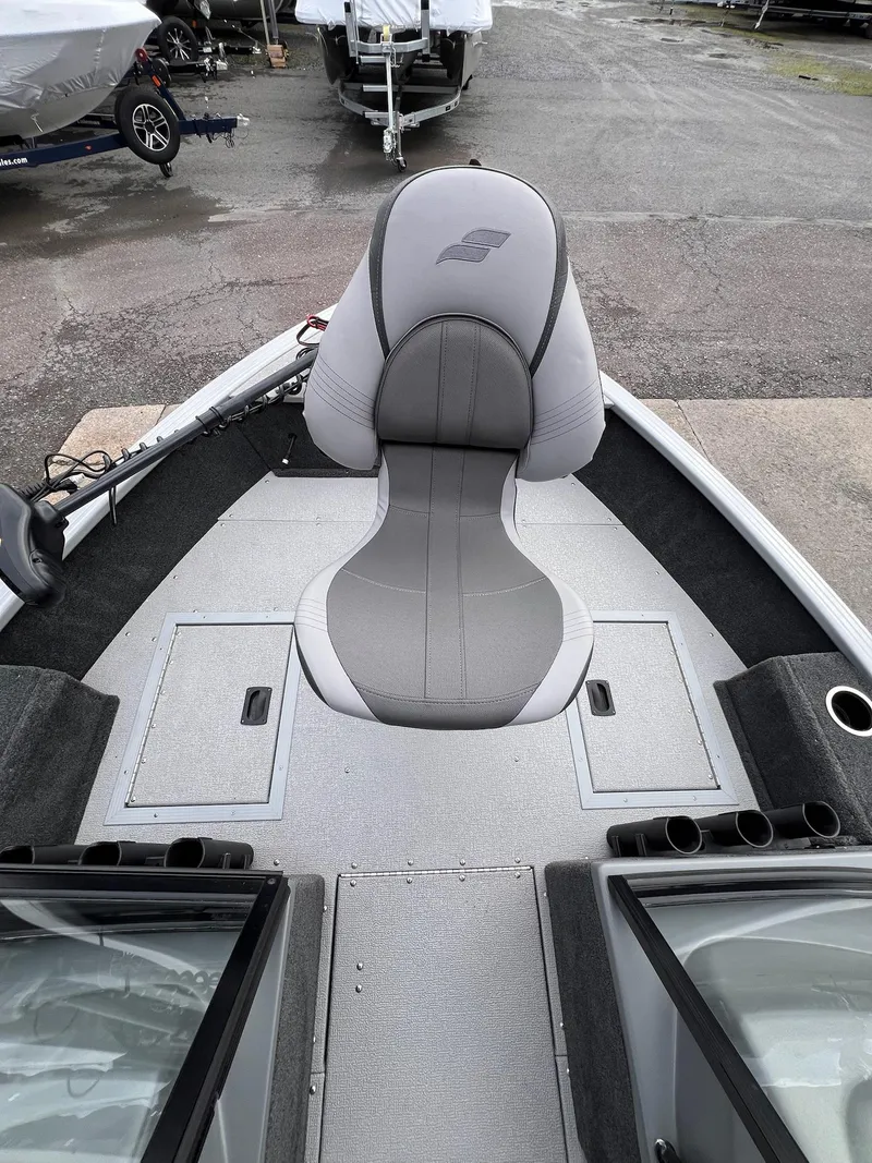 Slide: The Image of 2024 Starcraft Renegade 168 DC boat interior with gray seating and storage compartments. - 10