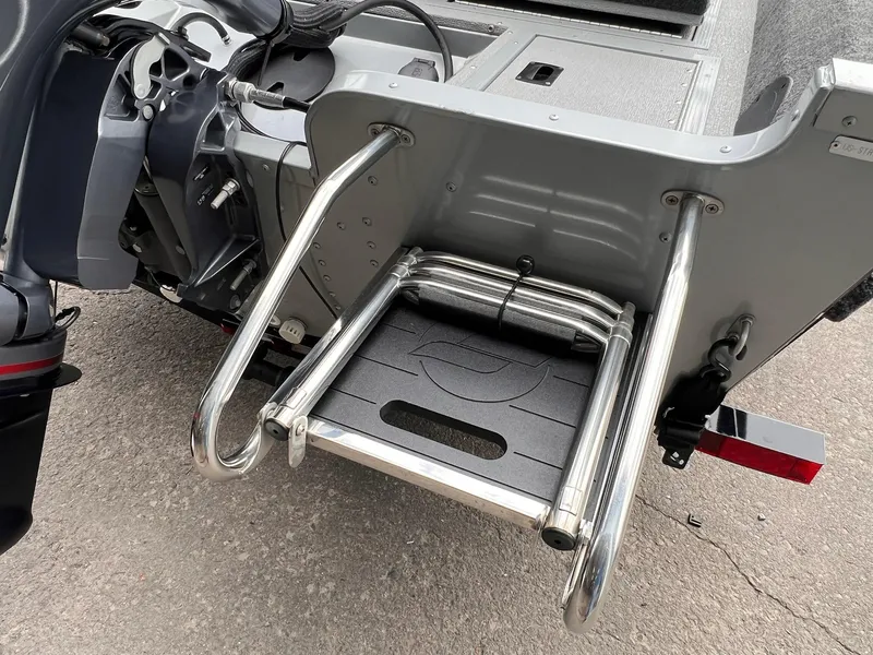 Slide: The Image of 2024 Starcraft Renegade 168 DC boat with stainless steel swim ladder and motor detail. - 20