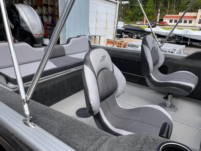 Slide: The Image of 2024 Starcraft Renegade 168 DC boat interior with Yamaha engine, featuring gray seating and modern design. - 29
