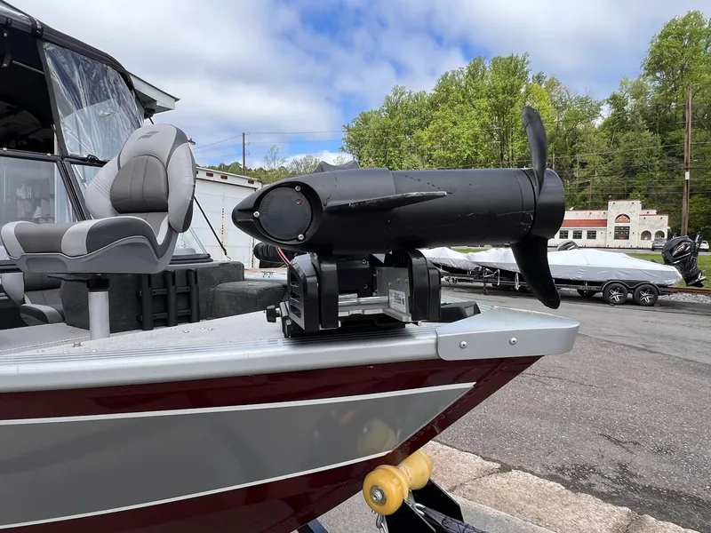 Slide: The Image of 2024 Starcraft Renegade 168 DC boat with motor and seating, outdoors. - 37