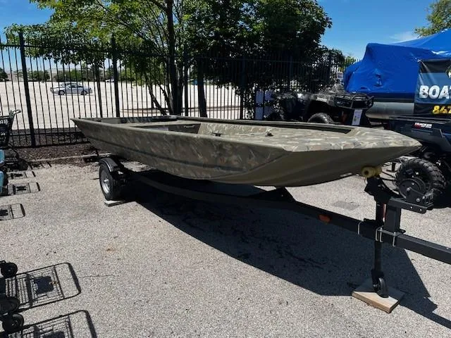 The Image of 2024 Tracker Grizzly 1648 Jon boat on trailer in outdoor setting. - 0