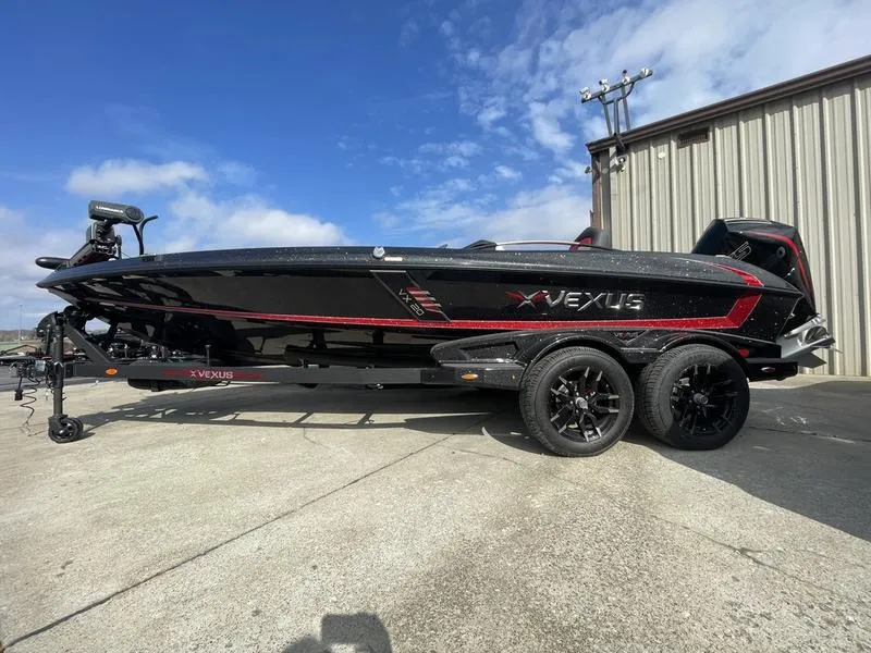 The Image of 2024 Vexus VX20 black and red bass boat on a trailer. - 1