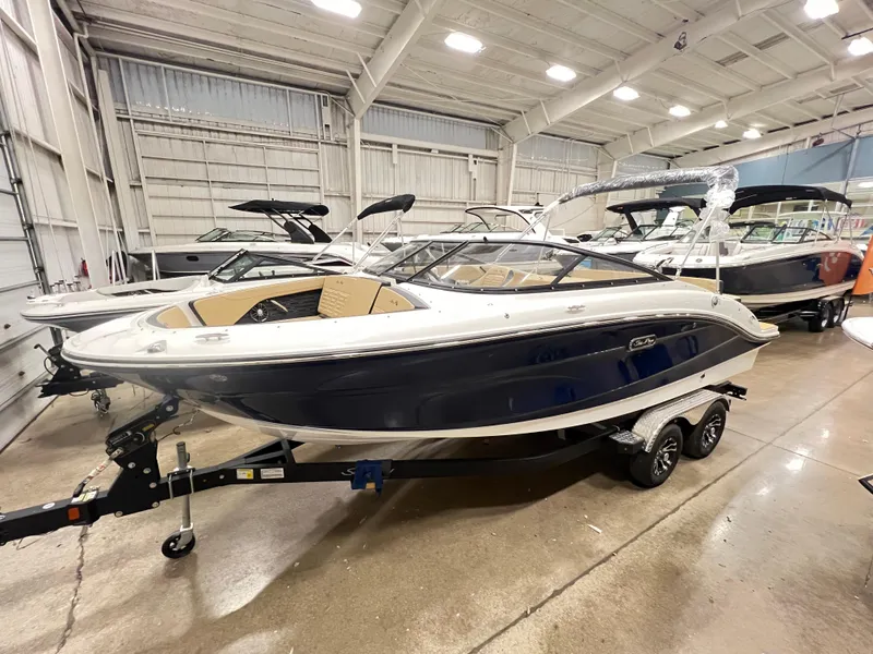 Slide: The Image of 2024 Sea Ray SPX 210 boat in showroom, side view. - 0