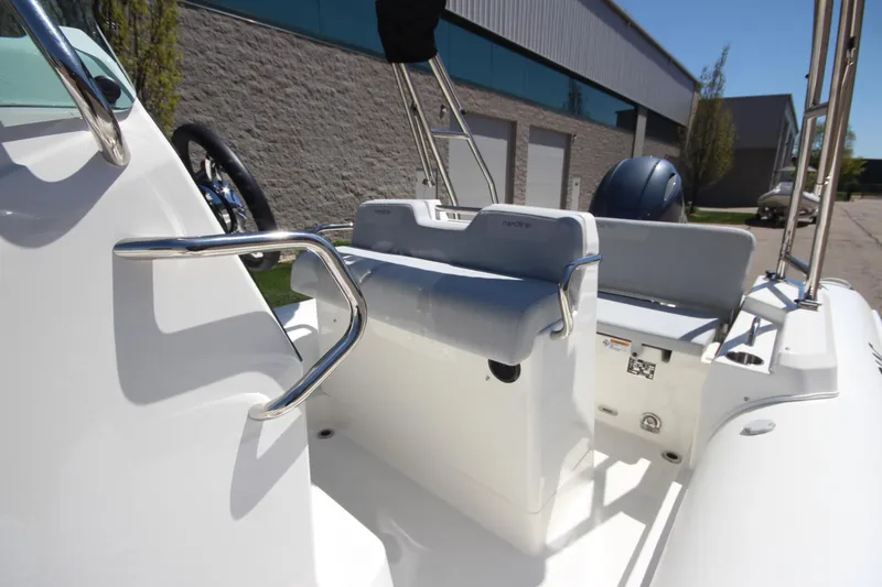 Slide: The Image of 2025 Zodiac Medline 5.8 NEO boat interior with seating and steering wheel. - 19