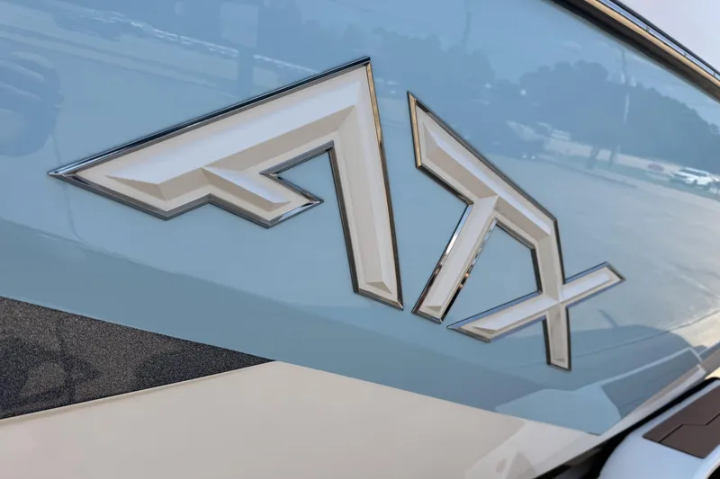 Slide: The Image of Close-up of 2024 ATX Surf Boats 24 Type-S logo on a sleek surface. - 25