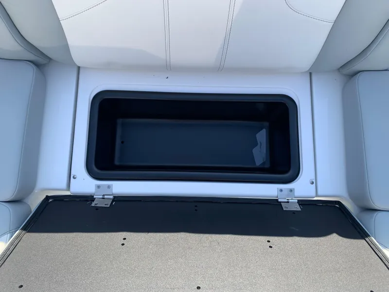 Slide: The Image of 2024 Malibu LX-R boat storage compartment with open lid. - 4
