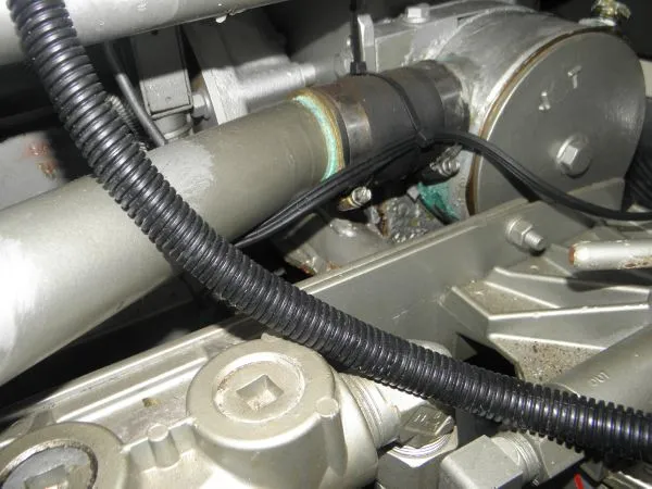 Slide: The Image of Close-up of the engine components of a 1988 Trojan 12 Meter Convertible boat. - 14