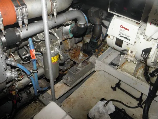 Slide: The Image of Engine room of a 1988 Trojan 12 Meter Convertible boat with Onan generator. - 17