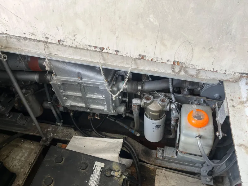 Slide: The Image of Engine compartment of a 1988 Trojan 12 Meter Convertible boat. - 22