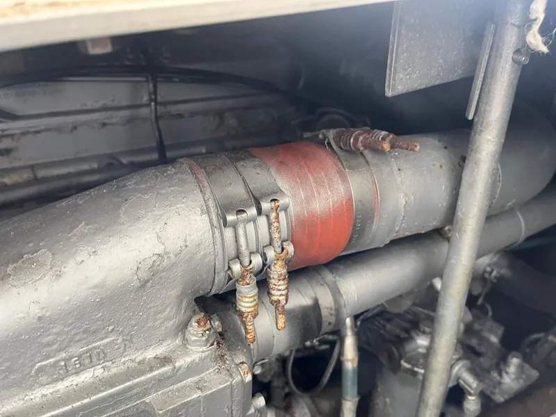 Slide: The Image of Engine components of a 1988 Trojan 12 Meter Convertible boat. - 24