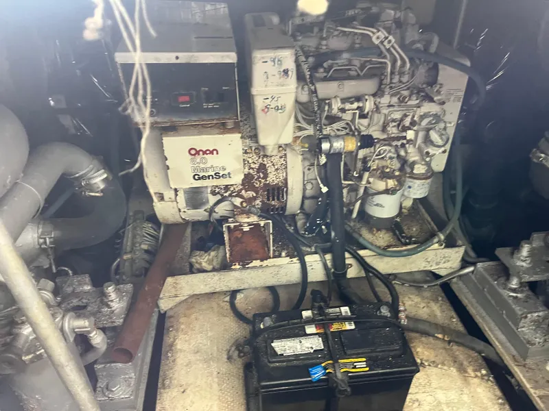Slide: The Image of Engine room of a 1988 Trojan 12 Meter Convertible with Onan Marine GenSet. - 26