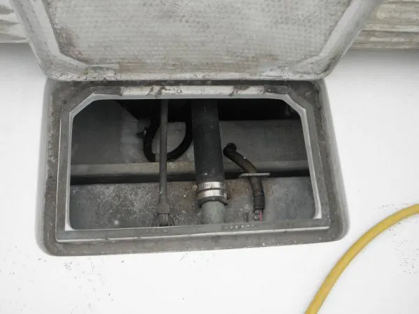 Slide: The Image of Open hatch of a 1988 Trojan 12 Meter Convertible boat showing internal components. - 20