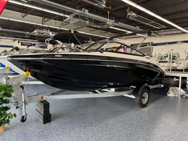 Slide: The Image of 2024 Yamaha Boats SX195 on trailer in showroom. - 0