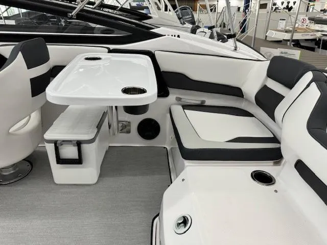 Slide: The Image of 2024 Yamaha Boats SX195 interior with seating and table, featuring modern design and comfort. - 14