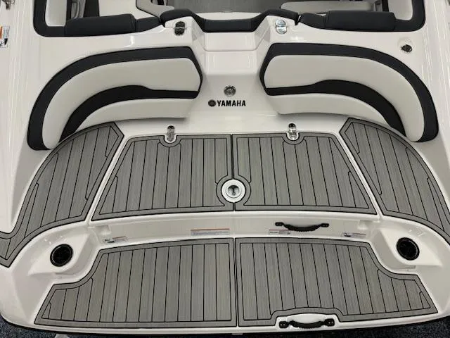 Slide: The Image of 2024 Yamaha Boats SX195 swim platform with sleek gray decking and black accents. - 16