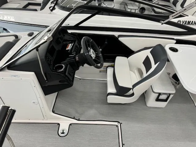 Slide: The Image of 2024 Yamaha Boats SX195 interior with sleek steering and modern seating. - 6