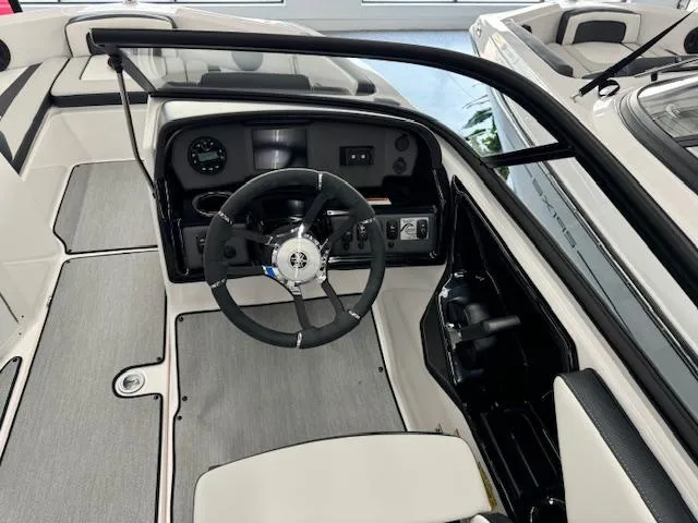 Slide: The Image of 2024 Yamaha Boats SX195 cockpit with steering wheel and dashboard controls. - 7