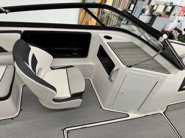 Slide: The Image of 2024 Yamaha Boats SX195 interior with sleek seating and modern dashboard design. - 8