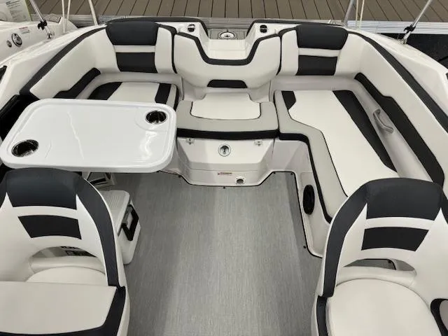 Slide: The Image of 2024 Yamaha Boats SX195 interior with sleek seating and table setup. - 9