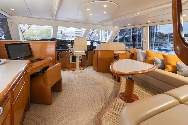 Slide: The Image of Luxurious interior of 2000 Viking 72 Convertible yacht with helm, seating, and navigation equipment. - 10