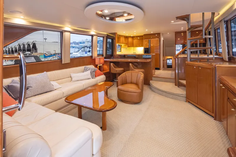 Slide: The Image of Luxurious interior of 2000 Viking 72 Convertible yacht with modern furnishings and spacious layout. - 11