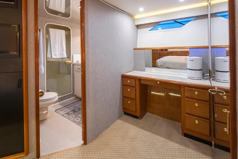 Slide: The Image of Luxurious interior of 2000 Viking 72 Convertible yacht with bathroom and vanity area. - 20