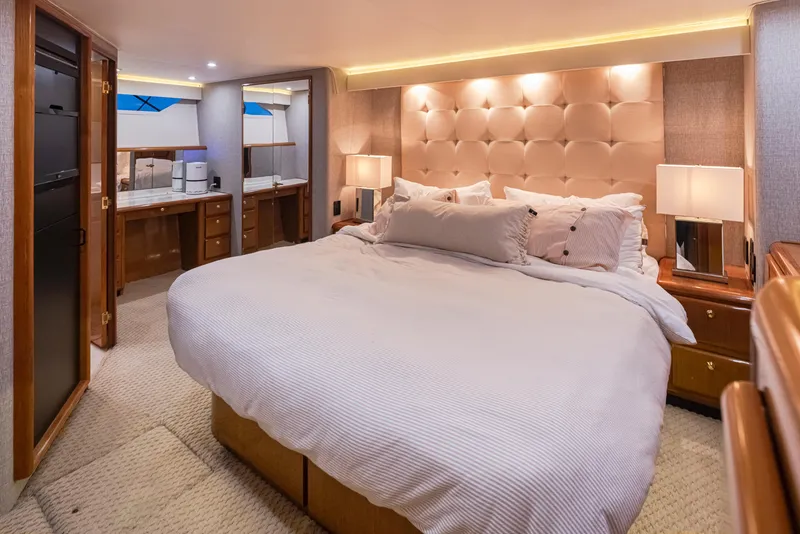 Slide: The Image of Luxurious bedroom interior of 2000 Viking 72 Convertible yacht with king-size bed. - 21