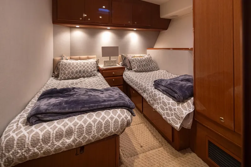 Slide: The Image of Twin bed cabin interior of 2000 Viking 72 Convertible yacht. - 22