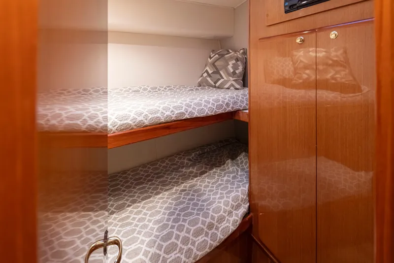 Slide: The Image of Bunk beds in the 2000 Viking 72 Convertible yacht cabin. - 28